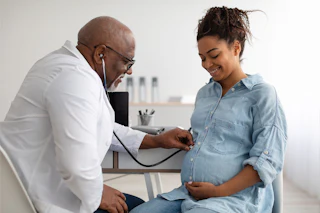 Pregnant Woman with Doctor Healthy Weight Gain