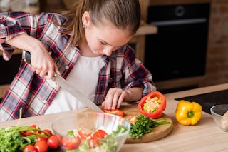 Teens and Young Adults with Obesity - Understanding Nutrition - Teen Cutting Vegetables